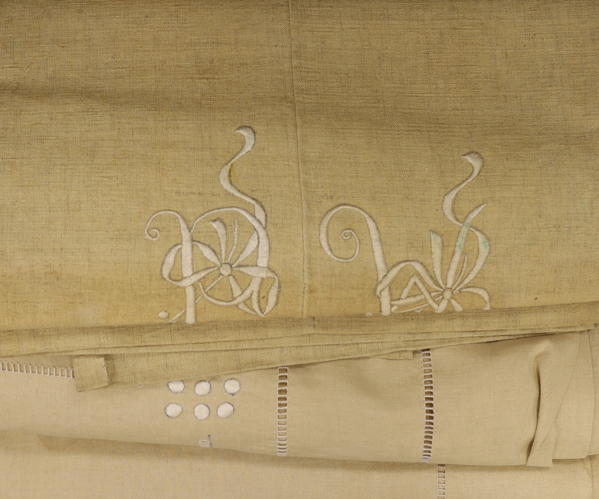 Four French Provincial coarse cream linen sheets, with white embroidered and monogrammed turn back tops